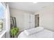 Bright bedroom with a large window, letting in plenty of light, plus a full-length mirror and a potted plant at 2104 New Hope Branch Way, Belmont, NC 28012