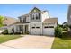 Well-maintained home with a two-car garage and a cozy front porch at 2104 New Hope Branch Way, Belmont, NC 28012
