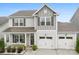 Charming two-story home with a well-kept lawn and an attached two-car garage at 2104 New Hope Branch Way, Belmont, NC 28012