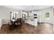 Modern kitchen with white cabinets, stainless steel appliances, and a center island with seating at 2104 New Hope Branch Way, Belmont, NC 28012