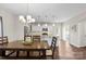Bright eat-in kitchen featuring a wooden dining table and a view of the stainless steel appliances at 2104 New Hope Branch Way, Belmont, NC 28012
