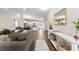 Open-concept living space with hardwood floors and a view into the kitchen at 2104 New Hope Branch Way, Belmont, NC 28012