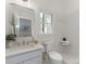 Well-lit bathroom showcases a sleek vanity, modern fixtures, and a refreshing shower space at 21404 Blakely Shores Dr, Cornelius, NC 28031