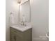 Stylish bathroom featuring a sleek vanity with granite countertop, modern fixtures, and a minimalist design at 21404 Blakely Shores Dr, Cornelius, NC 28031
