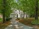 Stately home boasting beautiful landscaping and a cobblestone driveway at 21404 Blakely Shores Dr, Cornelius, NC 28031
