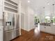 Spacious kitchen features a stainless refrigerator, ample storage and hardwood flooring at 21404 Blakely Shores Dr, Cornelius, NC 28031