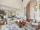 Spacious living room featuring an open layout, hardwood floors, and stylish decor for comfortable gatherings at 21404 Blakely Shores Dr, Cornelius, NC 28031