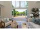 Open living room boasts bi-fold doors opening to a spacious deck and green landscape at 21404 Blakely Shores Dr, Cornelius, NC 28031