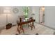 Inviting home office with natural light, featuring a stylish desk and a view of the outdoor greenery at 21404 Blakely Shores Dr, Cornelius, NC 28031
