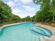 Inviting in-ground pool featuring a spa and poolside views at 21404 Blakely Shores Dr, Cornelius, NC 28031