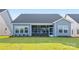 Exterior of home with a well-maintained backyard, screened in porch and tidy landscaping at 219 Tillery Ln # 755, Mount Gilead, NC 27306
