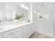 Well-lit bathroom features double sinks, a glass shower, and modern finishes at 219 Tillery Ln # 755, Mount Gilead, NC 27306