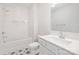 Well-lit bathroom with white subway tile in tub/shower, decorative floor tiles, and modern vanity at 219 Tillery Ln # 755, Mount Gilead, NC 27306