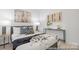 Well-decorated bedroom with contemporary artwork, matching lamps, and stylish bedding creating a comfortable, inviting atmosphere at 219 Tillery Ln # 755, Mount Gilead, NC 27306