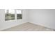 Bright bedroom with a large window, new floors, and ample natural light at 219 Tillery Ln # 755, Mount Gilead, NC 27306