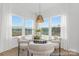 Cozy breakfast nook with a glass table, comfortable chairs, and lots of natural light at 219 Tillery Ln # 755, Mount Gilead, NC 27306