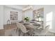 Elegant dining room with chandelier, stylish furnishings, and lots of natural light at 219 Tillery Ln # 755, Mount Gilead, NC 27306