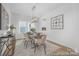 Elegant dining room with chandelier, stylish furnishings, and lots of natural light at 219 Tillery Ln # 755, Mount Gilead, NC 27306