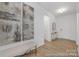 Spacious foyer with wood flooring, bench seating, and decorative artwork, creating a welcoming entrance to the home at 219 Tillery Ln # 755, Mount Gilead, NC 27306