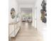 Inviting hallway with elegant decor, including a console table, mirror, and decorative metal wall art at 219 Tillery Ln # 755, Mount Gilead, NC 27306