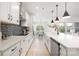 Modern kitchen with stainless steel appliances, subway tile backsplash, a large island, and bright natural light at 219 Tillery Ln # 755, Mount Gilead, NC 27306