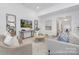 Open-concept living room with modern decor, a large TV, and lots of natural light at 219 Tillery Ln # 755, Mount Gilead, NC 27306