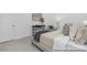 Cozy primary bedroom featuring a well-made bed, stylish decor, and soft carpet, offering a serene personal space at 219 Tillery Ln # 755, Mount Gilead, NC 27306