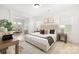 Bright main bedroom boasts windows, wood floors, and elegant decor at 219 Tillery Ln # 755, Mount Gilead, NC 27306