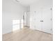 Unfurnished room with hardwood floors, white walls, and recessed lighting at 219 Tillery Ln # 755, Mount Gilead, NC 27306