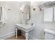 Bathroom with pedestal sink, stylish mirror, and decorative sconces at 2268 New Gray Rock Rd, Fort Mill, SC 29708
