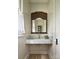 Elegant bathroom featuring marble countertop, antique mirror, and neutral wall paneling at 2268 New Gray Rock Rd, Fort Mill, SC 29708