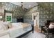 Bedroom with patterned wallpaper, a ceiling fan and a bed with white linens at 2268 New Gray Rock Rd, Fort Mill, SC 29708