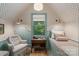 Charming bedroom with floral wallpaper, a twin bed, and an upholstered chair at 2268 New Gray Rock Rd, Fort Mill, SC 29708