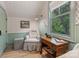Charming bedroom with floral wallpaper, a small desk, and an upholstered chair at 2268 New Gray Rock Rd, Fort Mill, SC 29708