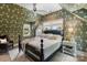 Bedroom with patterned wallpaper, ceiling fan, and bed with white linens at 2268 New Gray Rock Rd, Fort Mill, SC 29708
