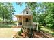 Charming home with a welcoming front porch, steps, and landscaped surroundings at 2268 New Gray Rock Rd, Fort Mill, SC 29708