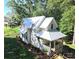 Charming two-story home with a welcoming porch, white exterior, and well-maintained lawn surrounded by trees at 2268 New Gray Rock Rd, Fort Mill, SC 29708