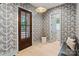 Foyer with patterned wallpaper, hardwood floors, a bench, and a front door with glass panels at 2268 New Gray Rock Rd, Fort Mill, SC 29708