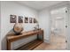Hallway featuring a wooden console table with artwork and access to a bathroom at 2268 New Gray Rock Rd, Fort Mill, SC 29708