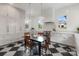 Bright eat-in kitchen features checkerboard floors, white cabinets, and stainless steel appliances at 2268 New Gray Rock Rd, Fort Mill, SC 29708