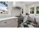 Modern kitchen featuring stainless steel appliances, marble backsplash, and bright windows at 2268 New Gray Rock Rd, Fort Mill, SC 29708