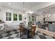 Bright eat-in kitchen features checkerboard floors, white cabinets, and stainless steel appliances at 2268 New Gray Rock Rd, Fort Mill, SC 29708