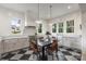 Bright eat-in kitchen features checkerboard floors, white cabinets, and stainless steel appliances at 2268 New Gray Rock Rd, Fort Mill, SC 29708