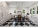 Bright eat-in kitchen features checkerboard floors, white cabinets, and stainless steel appliances at 2268 New Gray Rock Rd, Fort Mill, SC 29708
