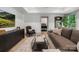Comfortable living room featuring a modern TV, stylish furniture, and beautiful hardwood floors at 2268 New Gray Rock Rd, Fort Mill, SC 29708