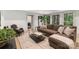 Cozy living room with wood floors, brown couch, and an open doorway leading to another room at 2268 New Gray Rock Rd, Fort Mill, SC 29708