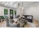 Living room with beamed ceilings, hardwood floors, and views of the outdoor deck at 2268 New Gray Rock Rd, Fort Mill, SC 29708