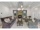 Living room showcasing a stone fireplace, beamed ceilings, and hardwood floors at 2268 New Gray Rock Rd, Fort Mill, SC 29708