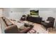 Living room with a couch and chairs, dark wood accent furniture, and a TV mounted on the wall at 2268 New Gray Rock Rd, Fort Mill, SC 29708