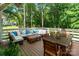 Spacious outdoor deck with comfortable seating area and dining table, perfect for entertaining with scenic wooded views at 2268 New Gray Rock Rd, Fort Mill, SC 29708